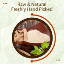 Ashwagandha Powder in a wooden bowl with roots and fresh leaves, labeled Raw and Natural, Freshly Hand Picked.