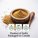 Organic coriander powder heaped in a carved wooden mortar with whole coriander seeds and a wooden pestle, labeled Vegan, 100% Organic, and Gluten Free; grown in India; packaged in Canada.