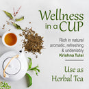 Krishna Tulsi Holy Basil Powder wellness slide showing dried tulsi powder beside a white ceramic teapot and cup of brewed herbal tea, promoting it as an aromatic and refreshing daily herbal tea.
