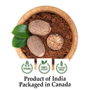 Organic Nutmeg Jaiphal Powder in a round wooden bowl with two whole nutmeg seeds, a halved nutmeg, and fresh green leaves; certified vegan, 100% organic, gluten-free, India-grown, and Canada-packaged.